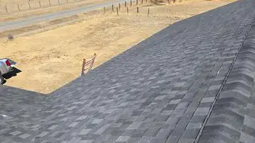 Roof replacement - Custom Exteriors, LLC Custom Exteriors replacing an asphalt shingle roof in Berthoud.