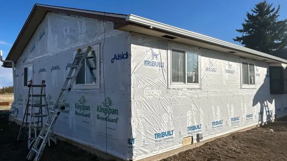 Siding 12 - Custom Exteriors, LLC Berthoud home with weather wrap prior to installing new vinyl siding.