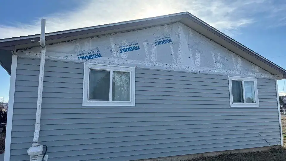 Siding replacement Berthoud - Custom Exteriors, LLC Berthoud home getting new siding from Custom Exteriors.